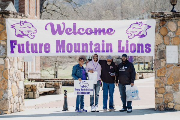 a group of people holding a sign